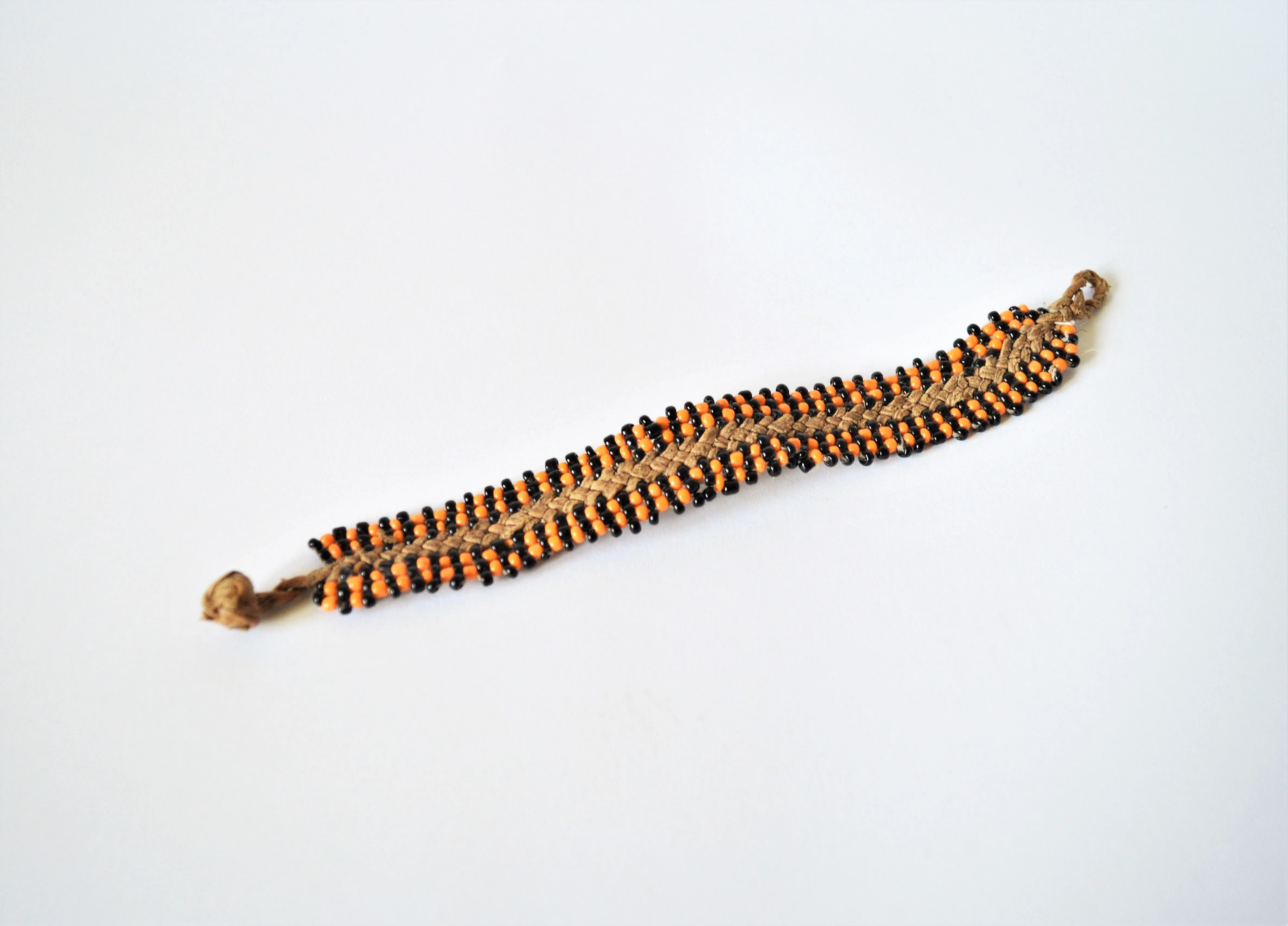 Leather bracelet orange and black beads, Boho friendship bracelet, Woven leather bracelet